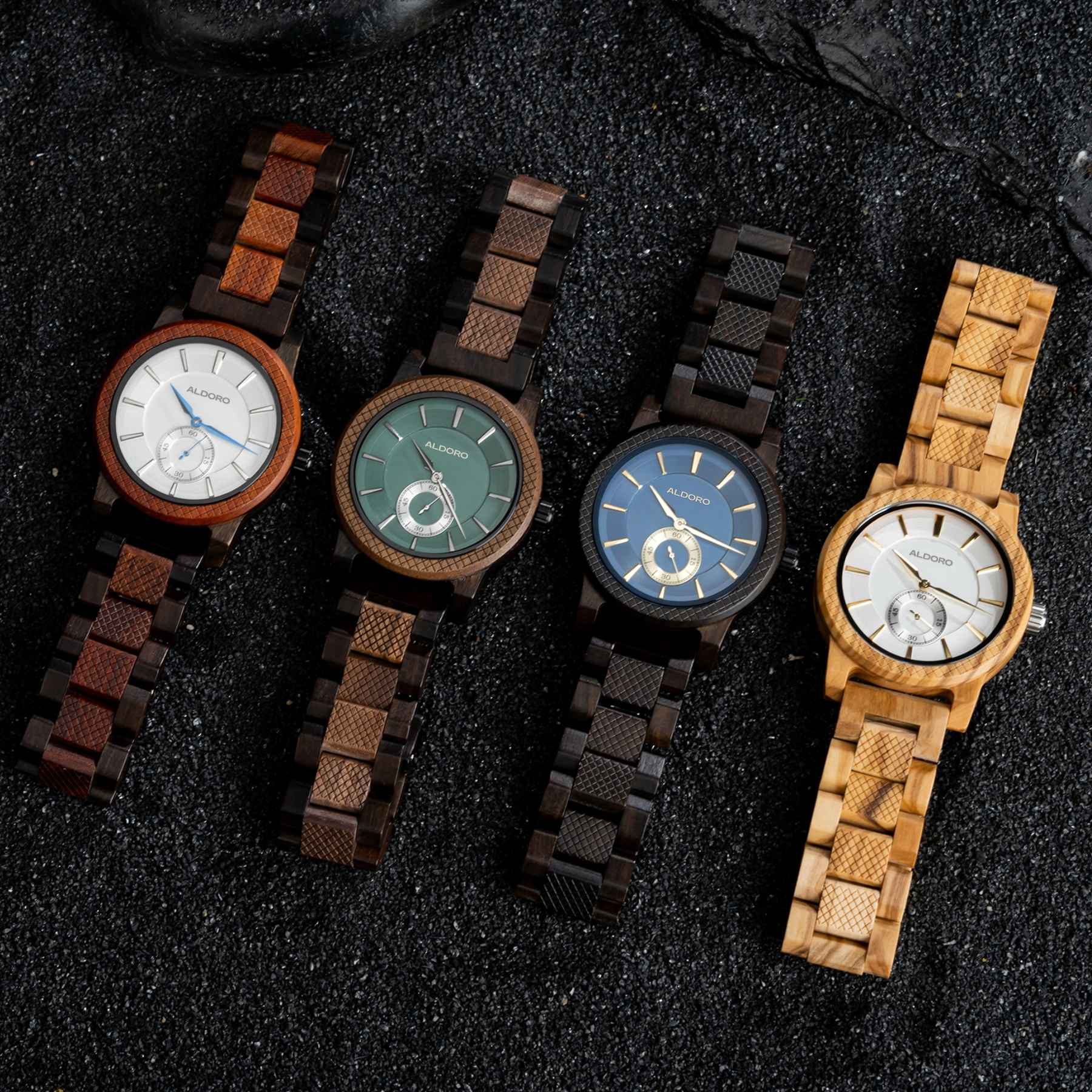 Four luxury wooden men’s watches from Aldoro Dubai featuring handcrafted designs in ebony, bamboo, sandalwood, and zebrawood displayed on a hero banner.
