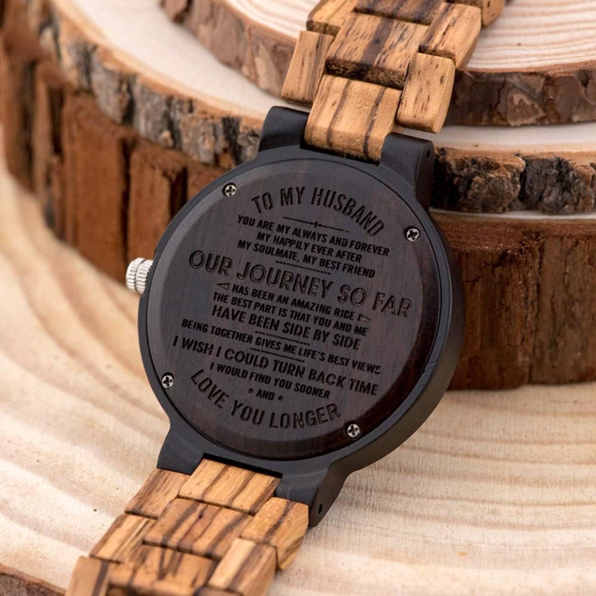 Close-up of an Aldoro wooden watch engraved on the back with a personalized romantic message, symbolizing unique and meaningful gifts.