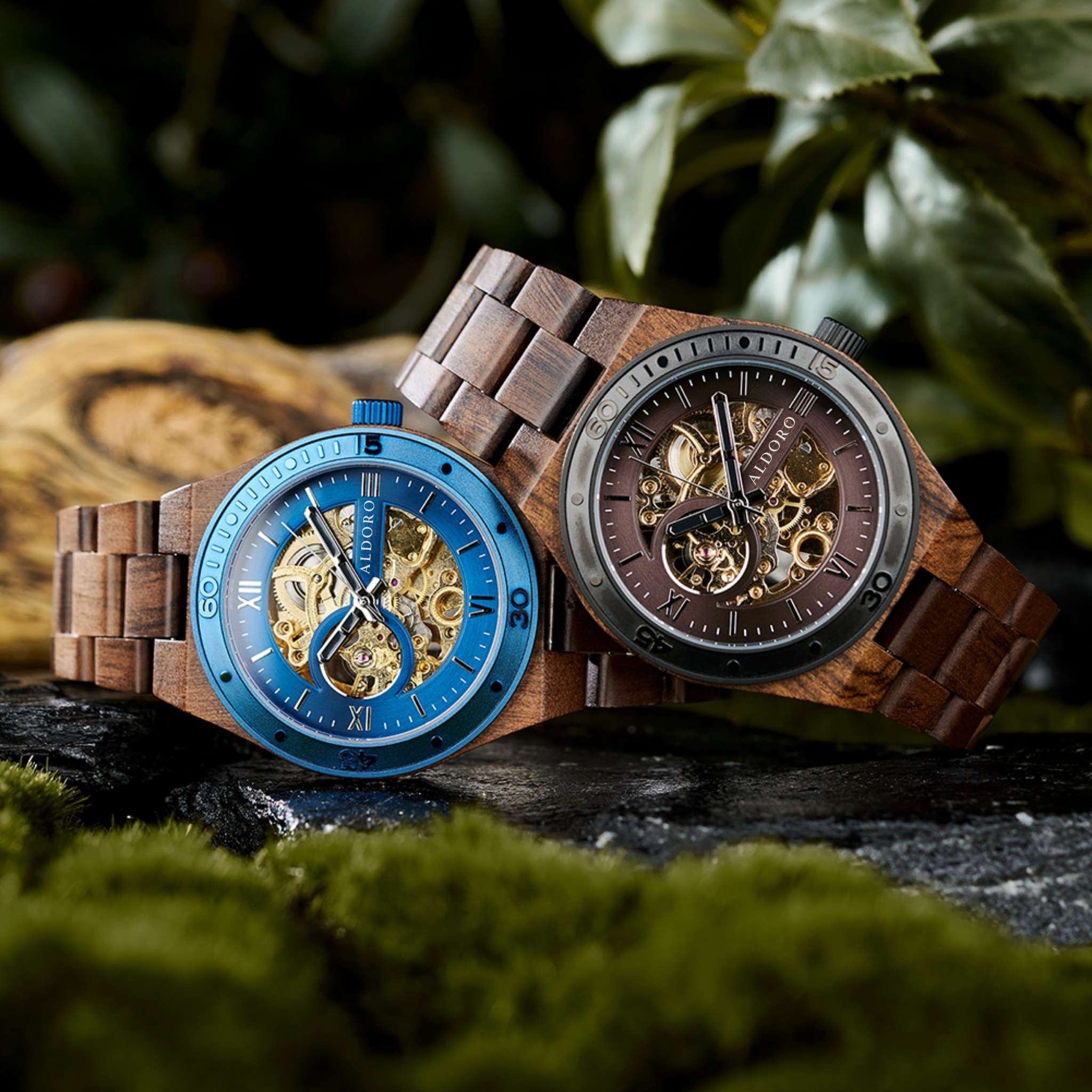 Two luxury wooden watches by Aldoro Watches, featuring open-heart dials in blue and brown tones, symbolizing the fusion of Italian precision and Latin American natural wood craftsmanship.