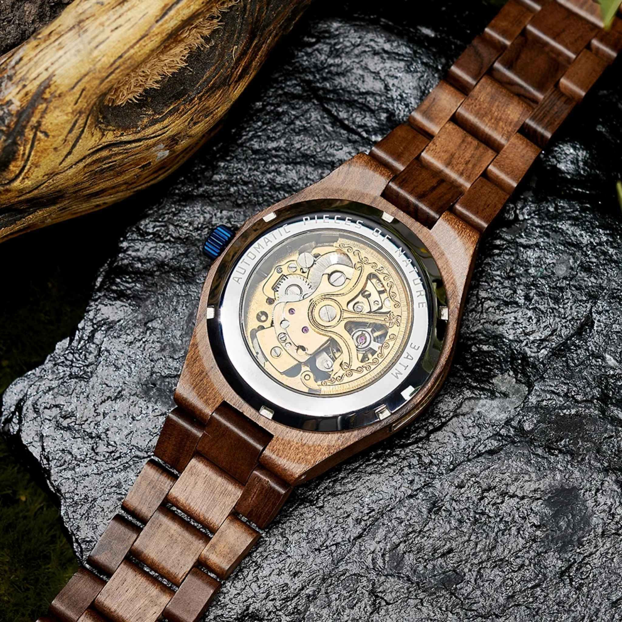 Back view of Aldoro luxury wooden watch showing exposed automatic movement and intricate gears through a transparent caseback, highlighting fine craftsmanship.