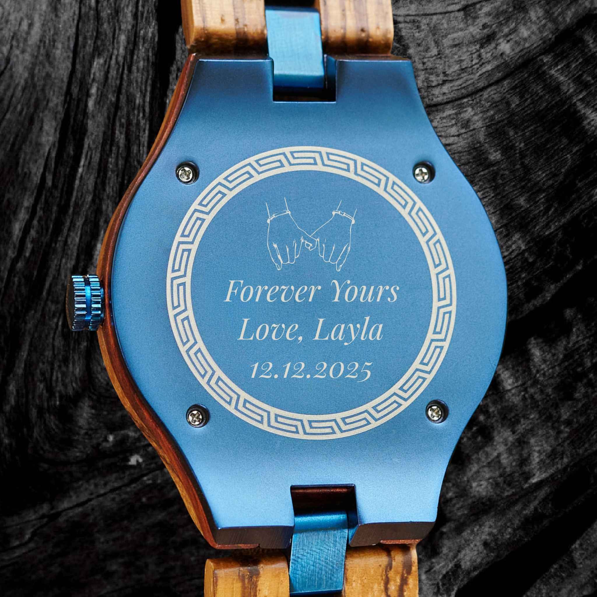 Close-up of Aldoro Voyager Blue watch engraved caseback with custom message Forever Yours Love, Layla and date, showcasing personalized gift engraving option.